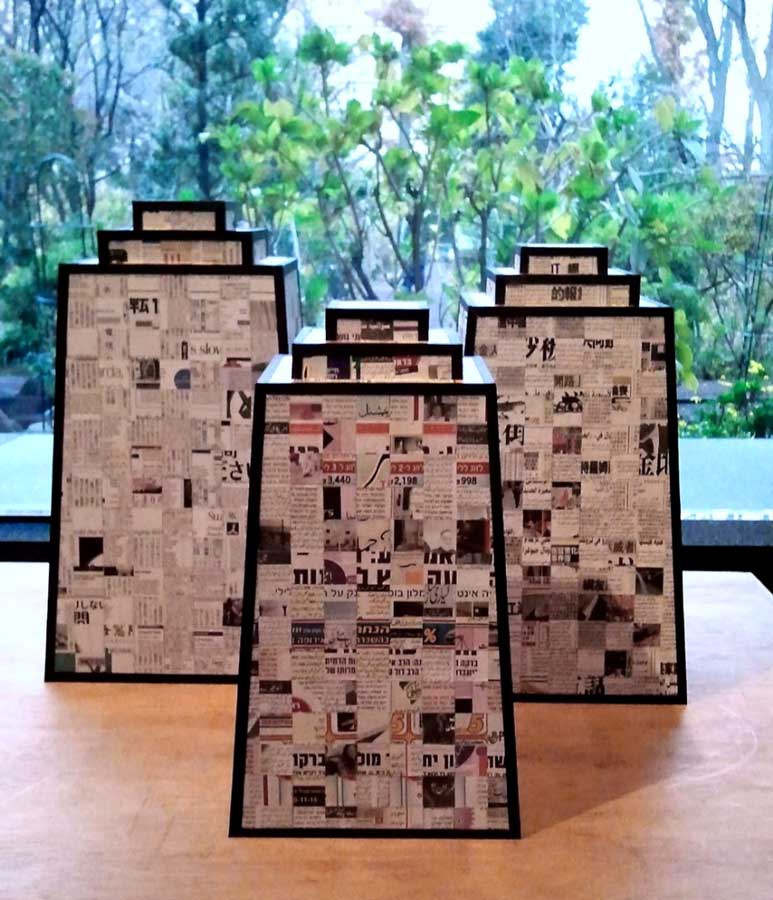 TOWERS OF BABEL | International newspapers, collage. Tallest tower is 50cms x 28cms x 28cms.