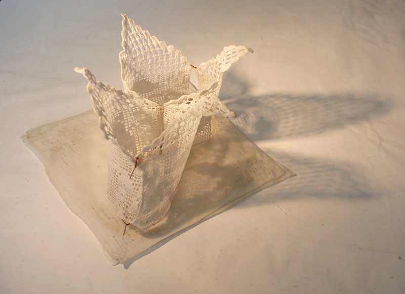 <strong>WAX VOTIVE</strong>  2012 <strong>|</strong>  29 cm X 15 cm X 15 cm beeswaxed lace and handkerchiefs, metal wire. 