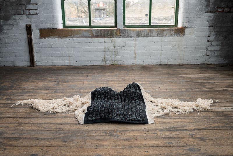 Rhythm of the Weave III | 2022 | Materials:  Jesmonite, debris, worsted wool, cotton | Techniques: Handcast jesmonite & tapestry weave | Image: Mat Dale 