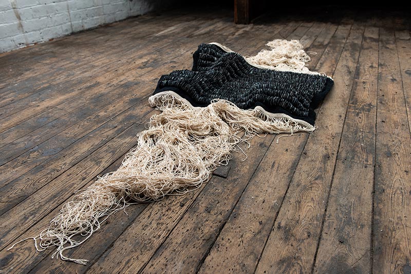 Rhythm of the Weave III | 2022 | Materials: Jesmonite, debris, worsted wool, cotton | Techniques: Handcast jesmonite & tapestry weave | Image: Mat Dale 