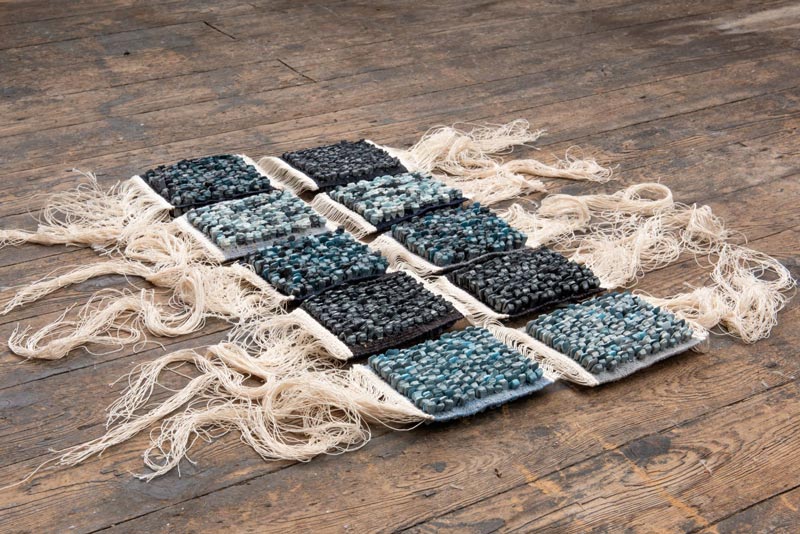 Guard Book Colour Study II-VI | 2021 | Materials: Jesmonite, debris, worsted wool, cotton |Techniques: Handcast jesmonite & tapestry weave | Image: Mat Dale