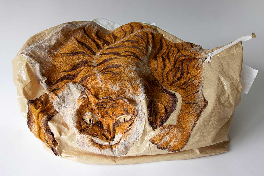 虎死留皮 人死留名。(When a tiger dies it leaves behind its skin, when a man dies he leaves behind his name.) | 2021. | Materials: Viscose thread, IKEA bag. | Techniques: Embroidery | Image: Woo Jin Joo