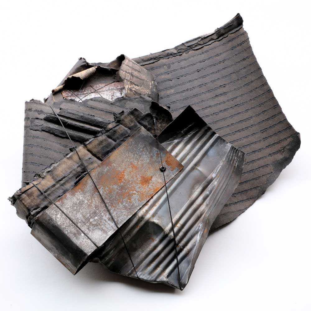 WRAPPED | Recycled food tins, ink, corrugated card, thread, nuts, bolts | H25 x W25 x D6 cm | Photo: Ann Goddard